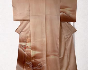 May include: A light brown silk kimono with a white and light brown design. The design features a stylized landscape with a mountain and clouds.