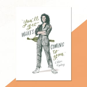 May include: Illustration of Ellen Ripley from the movie Alien, in a gray jumpsuit, arms crossed, holding a weapon. The quote "You'll get what's coming to you" is written in green script. The artwork is on a white background.