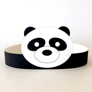 May include: Black and white panda face paper craft headband. The headband is made of black paper and the panda face is white with black eyes, nose, and ears.