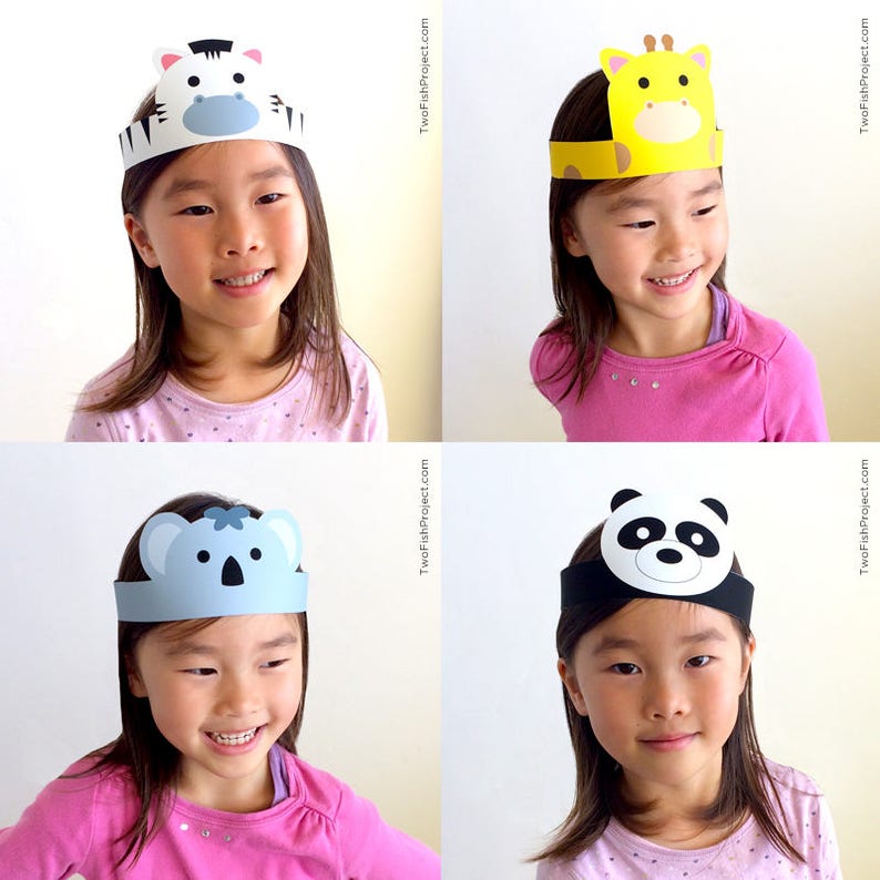 May include: Four children wearing paper animal headbands. The headbands feature a zebra, giraffe, koala, and panda. The children are all smiling and looking at the camera.