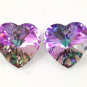 May include: Two iridescent purple heart-shaped crystal pendants with a silver loop at the top.