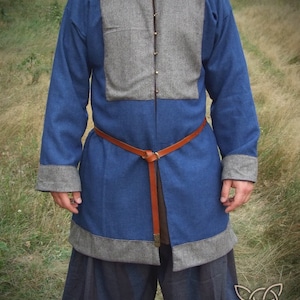 Medieval male coat with bronze buttons, historical reenactment, costume