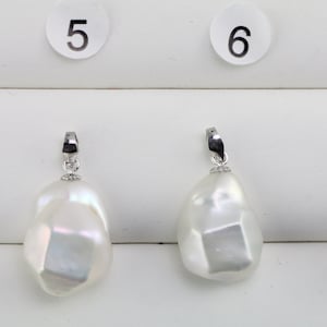 13-15mm wide white large baroque pearl pendant with silver bail,good quality