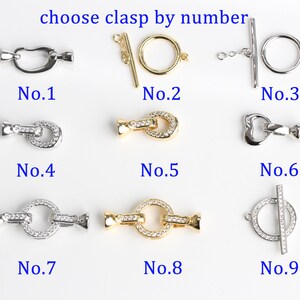 May include: Nine different jewelry clasps are displayed, each labeled with a number. The clasps vary in style, including toggle, lobster claw, and ring clasps. Some are silver-toned, others gold-toned, and some are embellished with clear crystals. The text "choose clasp by number" is at the top.