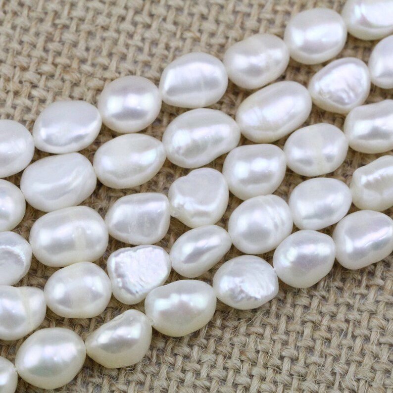 речной барочный жемчуг. жемчуг длинной формы. жемчуг речной натуральный. диаметр бусин. жемчужина овальной формы.