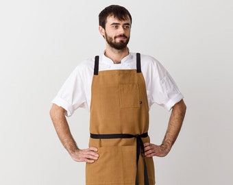 Cross back apron for men with pockets | Ochre canvas with Black Straps | Chefs, bakers, BBQ, shop, kitchen | Restaurant, Work, Professional