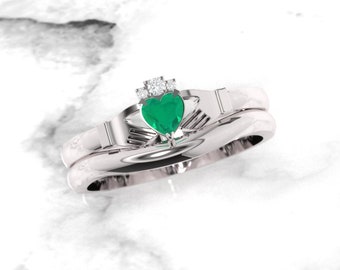 Emerald Claddagh ring, crafted in Ireland. Diamond and emerald claddagh ring with complimenting gently curved band.