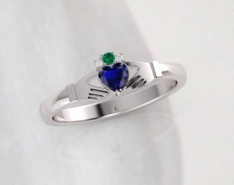 Claddagh ring, crafted in Ireland. Diamond and Sapphire claddagh ring featuring a diamond and emerald crown.