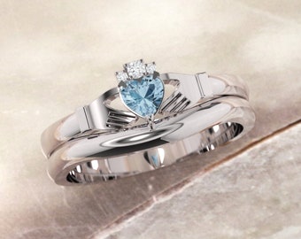 Blue topaz gemstone Claddagh ring, crafted in Ireland. Diamond and topaz claddagh ring with gently curved wedding ring.