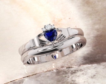 Claddagh ring. Diamond and Sapphire claddagh ring with matching band.