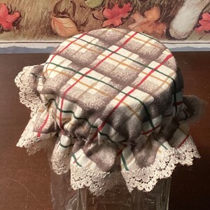 May include: A clear glass jar with a plaid fabric lid and lace trim. The background features a painting of a white rabbit and the text "You prepare a table before me in the presence of my enemies. Psalm 23:5."