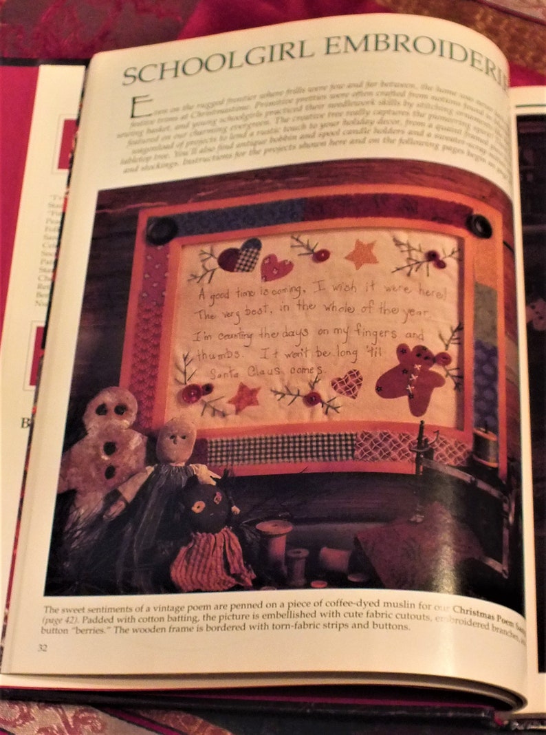May include: A vintage Christmas poem is embroidered on a piece of coffee-dyed muslin. The poem reads "A good time is coming. I wish it were here! The very best, in the whole of the year. I'm counting the days on my fingers and thumbs. It won't be long 'til Santa Claus comes."
