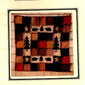 May include: A quilt pattern featuring a patchwork design with bears, trees, and stars. The quilt is made of various fabrics in shades of brown, red, and white. The pattern is titled "Bears 'n Forest" and is from Hooper Creek.