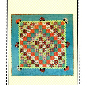 May include: A quilt pattern called "World Traveler" by Aunt Em's Quilts. The quilt is a patchwork of colorful squares with a teal border and a scalloped edge. The quilt is decorated with black buttons and hearts.