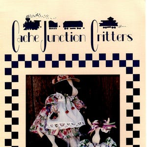 May include: Three handmade cow dolls dressed in colorful floral print dresses and gingham pants. The dolls are sitting on a wooden crate with straw. The dolls are part of a pattern called "Cow-a-Lily" from "Cache Junction Critters".
