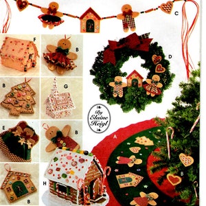 May include: A Simplicity Crafts sewing pattern for a gingerbread themed Christmas decor set. The pattern includes instructions for making a gingerbread house, a gingerbread wreath, a gingerbread tree skirt, and gingerbread ornaments. The pattern is by Elaine Heigl.