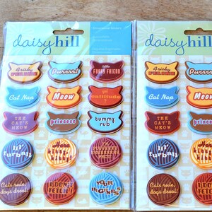 May include: Two packages of colorful cat-themed stickers with phrases like "Purrrr!" and "The Cat's Meow".