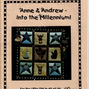 May include: A quilt pattern with a patchwork design featuring a star, a heart, and a bear. The quilt is titled "Anne & Andrew - into the Millennium!" and is by Bobbette Brady-Wilson.