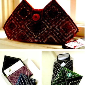 May include: Three different fabric pouches with embroidered designs. The pouches are in red, purple and green. The red pouch has a button closure. The purple pouch has a card inside. The green pouch has a mobile phone inside.