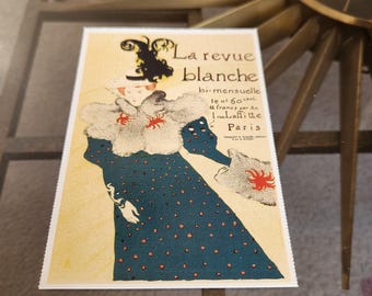 May include: A vintage advertisement for La Revue Blanche, a bi-monthly magazine published in Paris. The ad features a woman in a blue dress with white fur trim and red polka dots, holding a fan. The text reads "La revue blanche, bi-mensuelle, le n° 60 cent, 12 francs par An, Imprimerie Laffitte, Paris."