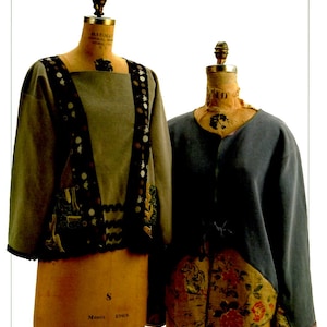 May include: Two sweatshirts displayed on dress forms, labeled Anna Claire Originals and Indygo Junction, Inc. IJ714 Restyled Sweatshirts S-XL. The left sweatshirt is gray with dark patterned panels and trim. The right sweatshirt is blue with a floral panel.