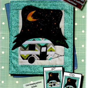 May include: A quilting pattern for a 12-inch by 14-inch "Little Camper" wall hanging. The pattern includes a camper silhouette with a moon and stars, and a cute camper design with a chevron pattern. The pattern is formatted for personal cutting machines. The pattern includes instructions for two hanging options: a 12-inch hanger and a 12x14 stand with header.