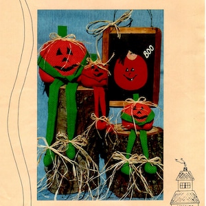 May include: A craft pattern for making 10-inch and 4-inch sitting pumpkin dolls. The pattern includes instructions for a girl pumpkin blackboard slate project. The pattern is titled "Mama Boo and 4" Baby Boo Sitting Pumpkins".