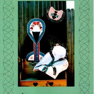 May include: A green and white pamphlet with the title "Sweatjacket II" and the text "from A Quilter's Wardrobe". The pamphlet features a photo of a quilted jacket with a heart design.