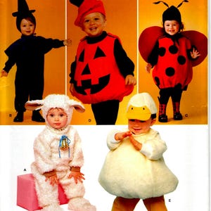 May include: A Simplicity sewing pattern for five baby costumes: a witch, a pumpkin, a ladybug, a lamb, and a duck. The pattern number is R11167.