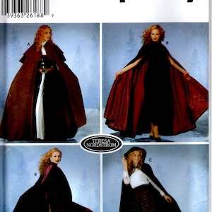 May include: Simplicity sewing pattern number 5794 for a cape. The pattern includes three different styles: a long, flowing cape with a hood, a shorter cape with a collar, and a cape with a hood and a plaid skirt. The pattern is available in sizes XS, S, M, and L.