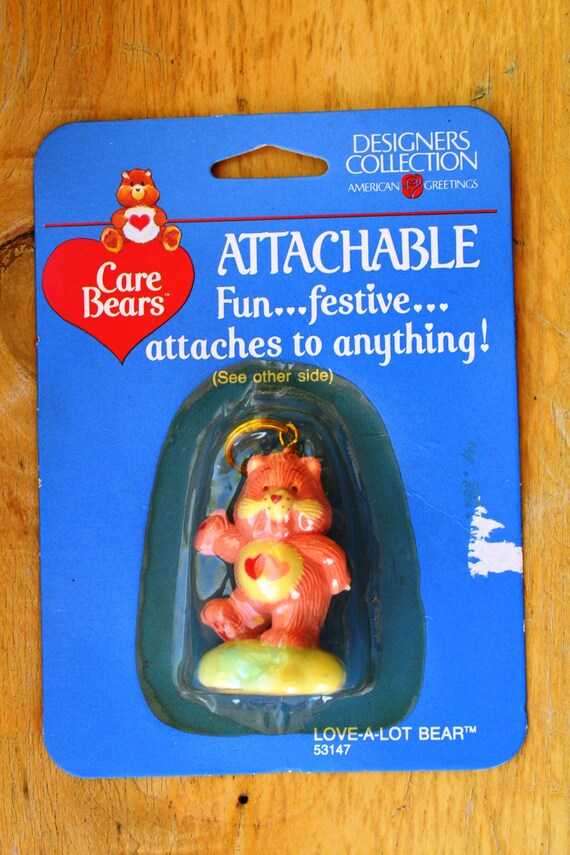 pink care bear with 2 hearts