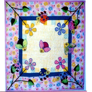 May include: A colorful quilt with a yellow background and a blue and white checkered border. The quilt features a variety of flowers and ladybugs in a whimsical design.
