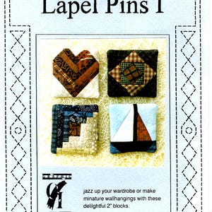 May include: Four small quilt blocks, each measuring 2 inches, are shown on a light yellow background. The blocks are a heart, a square, a log cabin, and a sailboat. The blocks are made of various fabrics in shades of brown, blue, red, and white. The image is from a pattern book titled "Foundation Impressions Lapel Pins I".