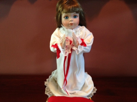 a christmas prayer porcelain doll