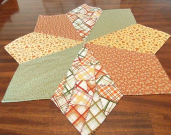 Beautiful reversible quilted table topper-star shape 26" diameter-assorted Fall prints in rust, green, gold, beige + more