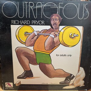 May include: Album cover for Richard Pryor's "Outrageous." The cover art features a cartoon illustration of Pryor lifting weights. The text "OUTRAGEOUS" is at the top, with "RICHARD PRYOR" below. The phrase "for adults only" is also present.