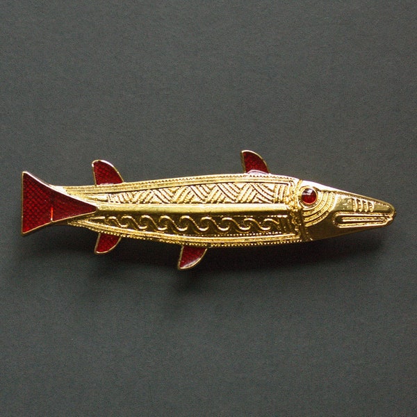 Anglo-Saxon fish brooch V-VIII century. Brass cast accessory with gold plating and enamel, historical early medieval Migration Period design
