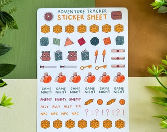 May include: A sticker sheet with the text "ADVENTURE TRACKER STICKER SHEET" features various icons like dice, potions, and swords. The stickers are designed with a fantasy theme, including the words "GAME NIGHT", "ENEMY", "ALLY", and "NPC".