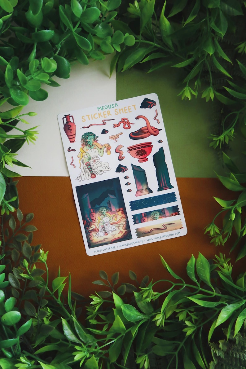 May include: A sticker sheet featuring illustrations of Medusa and related imagery. The sheet includes images of snakes, a red vase, and a depiction of Medusa in a temple. The text "MEDUSA STICKER SHEET" is at the top. The background is a mix of green, white, and brown.