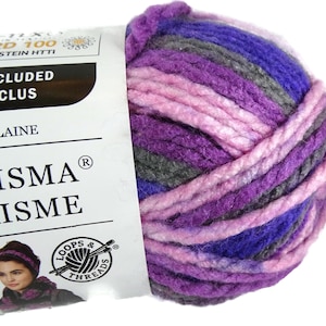 May include: A close-up of a ball of Charisma yarn in shades of purple, gray, and pink. The yarn is thick and textured, ideal for knitting or crocheting projects. The label includes the brand name and the Loops & Threads logo.