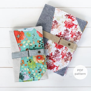 May include: Two fabric covered notebooks with a strap and buckle closure. One notebook has a floral pattern with red, orange, and green colors. The other notebook has a red and white floral pattern. Both notebooks have a gray fabric accent. The text "PDF pattern" is visible in the lower right corner of the image.