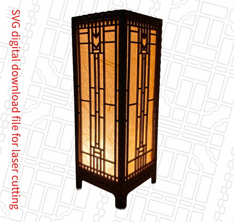 May include: A wooden lamp with a geometric design and a light brown paper shade. The lamp has a square base and a rectangular body. The design features a repeating pattern of squares and rectangles.