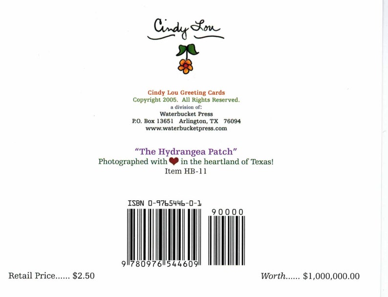 May include: A greeting card with the text "Cindy Lou" at the top, featuring a floral design. The card includes the title "The Hydrangea Patch" and copyright information. A barcode and ISBN are also visible.