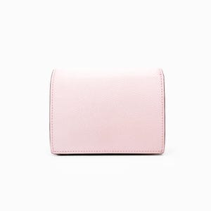 May include: A pale pink leather wallet with a smooth, textured finish.