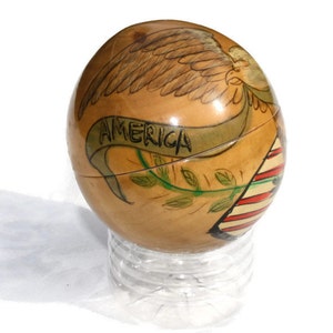Primitive painted globe shaped trinket box with eagle, flag, arrows, olive branch, and banner - Americana