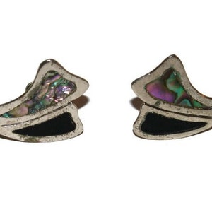 May include: A pair of silver earrings with a black and iridescent abalone shell design. The earrings are shaped like a wing or a leaf.