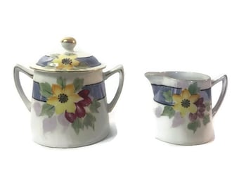 Japanese Lusterware Cream and Sugar Set with Flower and Ribbon Design