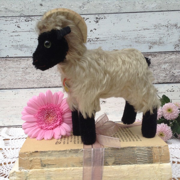 1960s Steiff Ram Snucki , Mountain Lamb, 6.5” tall, with paper tag. Mohair, green glass eyes. Vintage German stuffed farm animal sheep goat