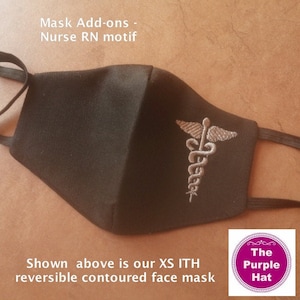 May include: A black contoured face mask with elastic ear loops, featuring an embroidered silver caduceus symbol. Text on the image reads: Mask Add-ons - Nurse RN motif. Shown above is our XS ITH reversible contoured face mask. The Purple Hat.