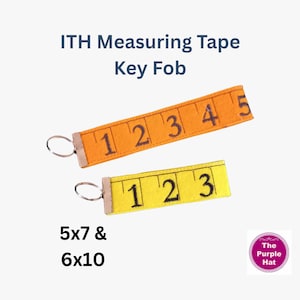 May include: Two key fobs shaped like measuring tapes, one orange with numbers 1 through 5 and one yellow with numbers 1 through 3. Each features a metal ring at the end. Text reads ITH Measuring Tape Key Fob and 5x7 & 6x10.